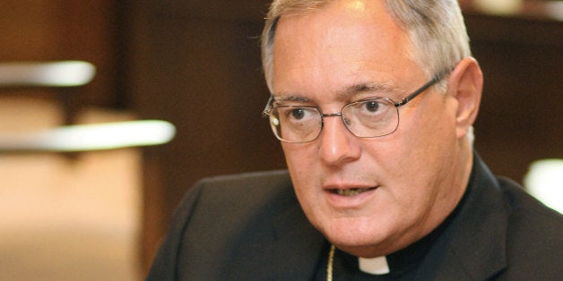 **ADVANCE FOR FRIDAY SEPT. 5** ** FILE ** Providence, R.I., Bishop Thomas Tobin, appears in his office in Providence in this Thursday, Aug. 21, 2008 file photo. In a letter Thomas has called on U.S. immigration authorities to stop arresting illegal immigrants in mass sweeps in Rhode Island. (AP Photo/Stew Milne, File)