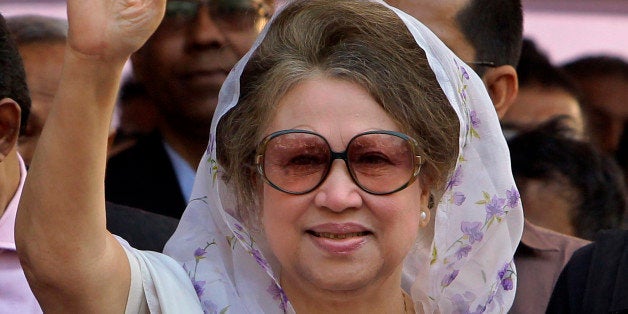 Bangladesh's former Prime Minister and opposition Bangladesh Nationalist Party (BNP) leader Khaleda Zia, waves as she arrives for a public meeting in Dhaka, Bangladesh, Monday, Jan. 20, 2014. The BNP had boycotted the violence-marred Jan. 5 election that was won by Sheikh Hasina led Awami League party. Zia says the election was illegal and seeks reelection with in the shortest possible time. (AP Photo/ A.M. Ahad)