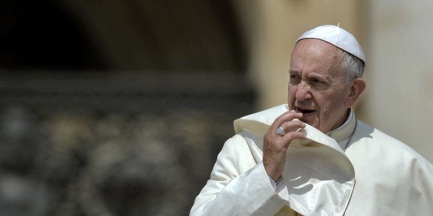 Pope Francis' gestures as he leads the weekly audience in Saint Peter's Square at the Vatican on June 24, 2015. AFP PHOTO / FILIPPO MONTEFORTE (Photo credit should read FILIPPO MONTEFORTE/AFP/Getty Images)