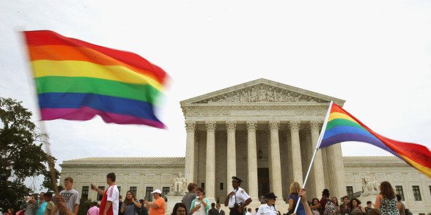 WASHINGTON, DC - JUNE 26: People celebrate in front of the U.S. Supreme Court after the ruling in favor of same-sex marriage June 26, 2015 in Washington, DC. The high court ruled that same-sex couples have the right to marry in all 50 states. (Photo by Mark Wilson/Getty Images)