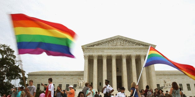 WASHINGTON, DC - JUNE 26: People celebrate in front of the U.S. Supreme Court after the ruling in favor of same-sex marriage