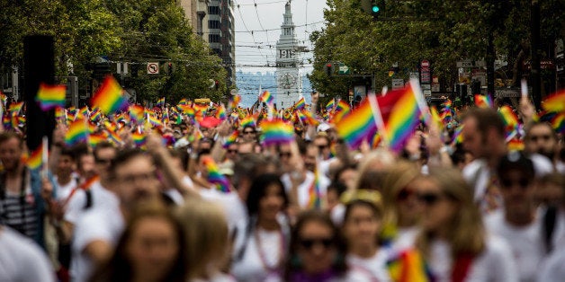 SAN FRANCISCO, CA- JUNE 28: San Francisco's Ferry Builiding is seen behind marchers in the San Francisco Gay Pride Parade, June 28, 2015 in San Francisco, California. The 2015 pride parade comes two days after the U.S. Supreme Court's landmark decision to legalize same-sex marriage in all 50 states. (Photo by Max Whittaker/Getty Images)