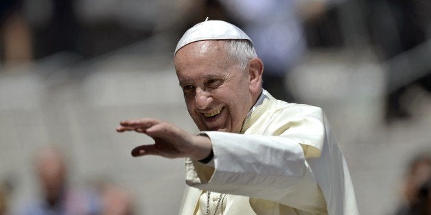 Pope Francis blesses the crowd at the end of the weekly audience in Saint Peter's Square at the Vatican on June 24, 2015. AFP PHOTO / FILIPPO MONTEFORTE (Photo credit should read FILIPPO MONTEFORTE/AFP/Getty Images)