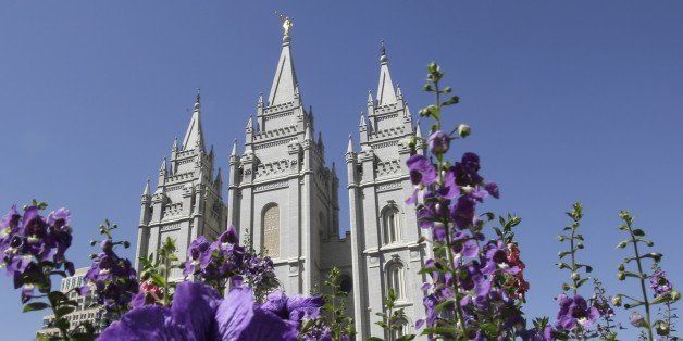 FILE- In this Sept. 3, 2014, file photo, shows flowers blooming in front of the Salt Lake Temple. in Temple Square, in Salt Lake City. Mormon church leaders are making a national appeal for a "balanced approach" in the clash between gay rights and religious freedom. The church is promising to support some housing and job protections for gays and lesbians in exchange for legal protections for believers who object to the behavior of others. (AP Photo/Rick Bowmer, File)