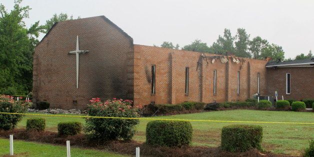 The Mount Zion AME Church in Greeleyville, S.C., is seen on Wednesday, July 1, 2015, after it was heavily damaged by fire. The church was the target of arson by the Ku Klux Klan two decades ago but a law enforcement source told The Associated Press that the most recent fire was not arson. (AP Photo/Bruce Smith)
