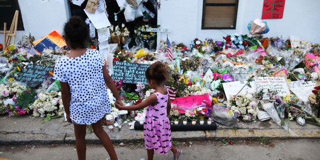 CHARLESTON, SC - JUNE 23: Children look on at the memorial in front of the Emanuel African Methodist Episcopal Church on Jun