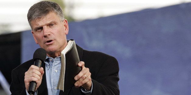 NEW YORK - JUNE 25: Franklin Graham, with Bible in hand addresses the crowd before his father Billy Graham speaks during his Crusade at Flushing Meadows Corona Park June 25, 2005 in the Queens borough of New York. Flushing Meadows Corona Park is the site for Graham's sermons on June 24-26, which looks to draw thousands of people from across the country, and will purportedly be the aging Christian evangelist's final crusade. (Photo by Stephen Chernin/Getty Images)