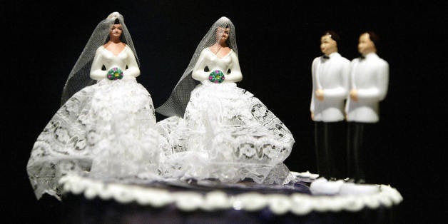 WEST HOLLYWOOD, UNITED STATES: A wedding cake featuring two grooms and two brides is on display at a local restaurant as part of the preparations for a mass gay wedding in West Hollywood, CA 01 June 2004. Some one hundred gay and lesbian couples tied nots in a ceremony performed by West Hollywood Mayor John Duran. Although simbolic, the ceremony was organized as part of a campaign organized by Duran and other non profit organizations in an effort to change California laws and allow same sex couples to get marriage licenses. AFP PHOTO / HECTOR MATA (Photo credit should read HECTOR MATA/AFP/Getty Images)