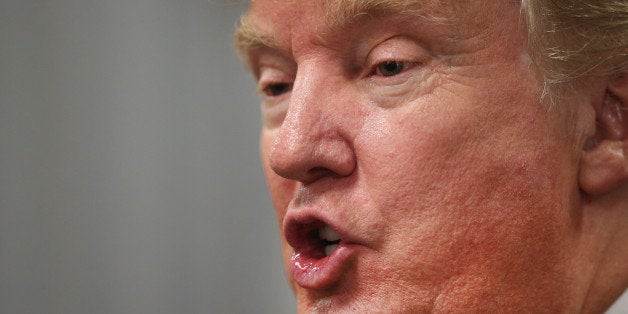 OSKALOOSA, IA - JULY 25: Republican presidential hopeful businessman Donald Trump speaks to the press following a rally on July 25, 2015 in Oskaloosa, Iowa. During his last visit to the state Trump sparked controversy when he said Senator John McCain (R-AZ), a former POW, was not a war hero. (Photo by Scott Olson/Getty Images)