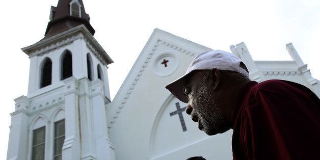 CHARLESTON, SC - JUNE 25: Members of the St. Stephen A.M.E. Church of Jacksonville, Florida sing hymns outside the memorial service for Rev. Clementa Pinckney at the Emanuel African Methodist Episcopal Church on June 25, 2015 in Charleston, South Carolina. Pinckney, who was also a state senator, was one of the nine victims killed in last week's shooting at the Emanuel African Methodist Episcopal Church in Charleston, South Carolina. (Photo by Win McNamee/Getty Images)