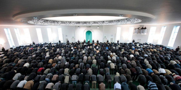 Worshippers from the Ahmadiyya Muslim community attend Friday prayers at the Baitul Futuh Mosque in south London, Friday, Feb
