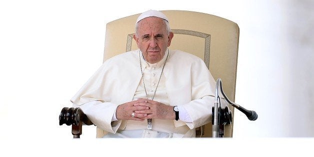 Pope Francis looks on during his weekly general audience in St Peter's square at the Vatican on September 9, 2015. In a lette