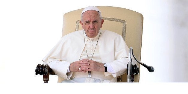 Pope Francis looks on during his weekly general audience in St Peter's square at the Vatican on September 9, 2015. In a letter to believers on September 8, the Argentinian pontiff said annulments would require approval by only one church tribunal, rather than two as currently. A streamlined procedure is to be introduced for the most straightforward cases and access to hearings will not cost anything, the letter states. AFP PHOTO / FILIPPO MONTEFORTE (Photo credit should read FILIPPO MONTEFORTE/AFP/Getty Images)