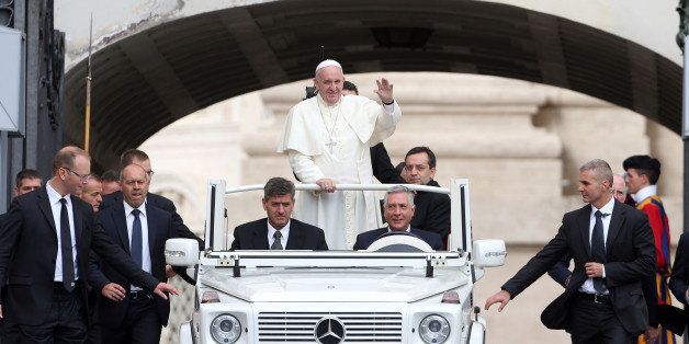 VATICAN CITY, VATICAN - SEPTEMBER 16: Pope Francis waves to the faithful as he arrives in St. Peter's Square for his weekly audience on September 16, 2015 in Vatican City, Vatican. Pope Francis on Wednesday appealed for prayers for his Apostolic Voyage to Cuba and to the United States, which begins on Saturday. (Photo by Franco Origlia/Getty Images)