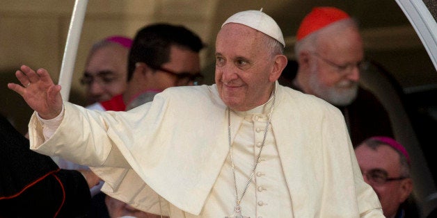 Pope Francis leaves after a meeting with a group of Cuban youth in Havana, Cuba, Sunday Sept. 20, 2015. Pope Francis met with Fidel Castro on Sunday before finishing the day with a vespers service in Havana's cathedral, and a meeting with the youths. In the background at right is Cardinal Sean Patrick O'Malley. (AP Photo/Ramon Espinosa)