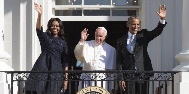 US President Barack Obama, First Lady Michelle Obama and Pope Francis wave during an arrival ceremony on the South Lawn of the White House in Washington, DC, September 23, 2015. More than 15,000 people packed the South Lawn for a full ceremonial welcome on Pope Francis' historic maiden visit to the United States. AFP PHOTO / JIM WATSON (Photo credit should read JIM WATSON/AFP/Getty Images)