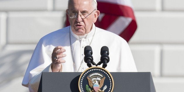 Pope Francis speaks during an arrival ceremony on the South Lawn of the White House in Washington, DC, September 23, 2015. More than 15,000 people packed the South Lawn for a full ceremonial welcome on Pope Francis' historic maiden visit to the United States. AFP PHOTO / JIM WATSON (Photo credit should read JIM WATSON/AFP/Getty Images)