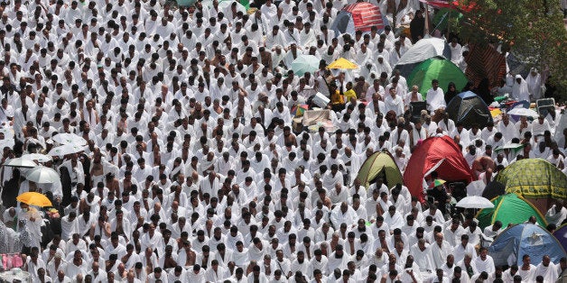 Muslim pilgrims pray outside Namira mosque in Arafat, on the second and most significant day of the annual hajj pilgrimage, near the holy city of Mecca, Saudi Arabia, Wednesday, Sept. 23, 2015. (AP Photo/Mosa'ab Elshamy)