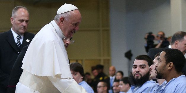 Pope Francis greets inmates during his visit to Curran-Fromhold Correctional Facility on Sunday, Sept. 27, 2015. (David Maialetti/Philadelphia Inquirer/TNS via Getty Images)