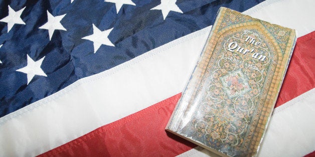 Close-up of Holy Quran on American flag.