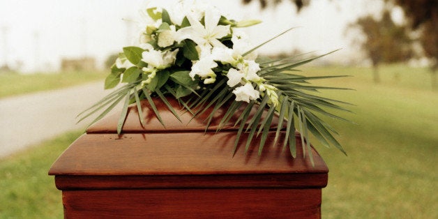 Funerary flowers over coffin