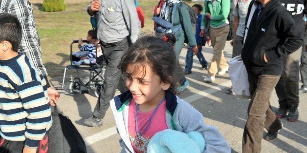 Migrants and refugees cross the Croatian-Hungarian border in the village of Baranjsko Petrovo Selo, near the North-Eastern Cr