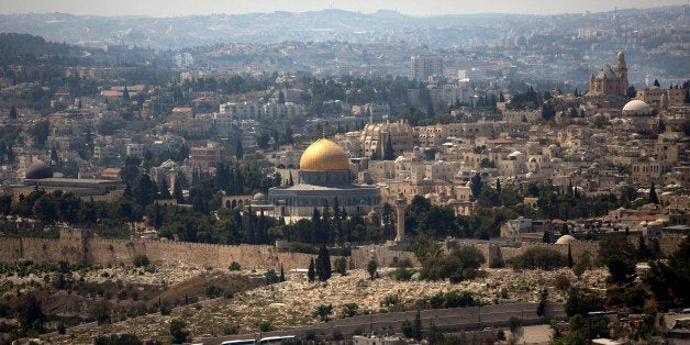 FILE - In this Sept. 9, 2013 file photo, the Dome of the Rock Mosque in the Al-Aqsa Mosque compound, known by the Jews as the Temple Mount, is seen in Jerusalem's Old City. Iyad Madani, the head of the world's largest Islamic organization paid a rare visit to Jerusalem's Al-Aqsa Mosque, Monday, Jan. 5, 2015, urging Muslims to follow suit and come to the city in a bid to strengthen Palestinian claims to the holy site. Madani is a citizen of Saudi Arabia, an Arab country that does not have diplomatic relations with Israel and which serves as the guardian of Islam's most important sites. (AP Photo/Sebastian Scheiner, File)