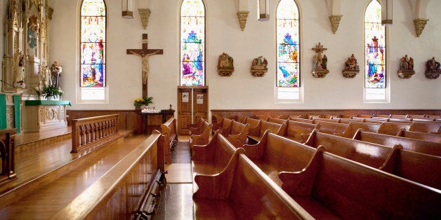 Pews and stained glass windows in church