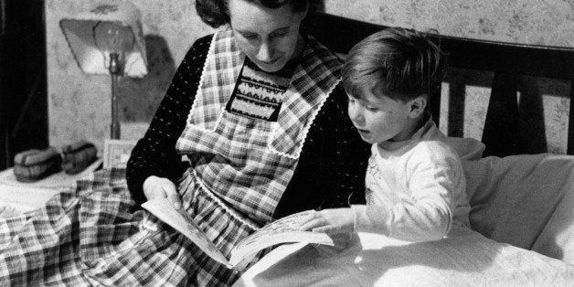 30th January 1954: Scotland's youngest film star Vincent Winter is ready for bed and Mum tells him a story. Original Publica