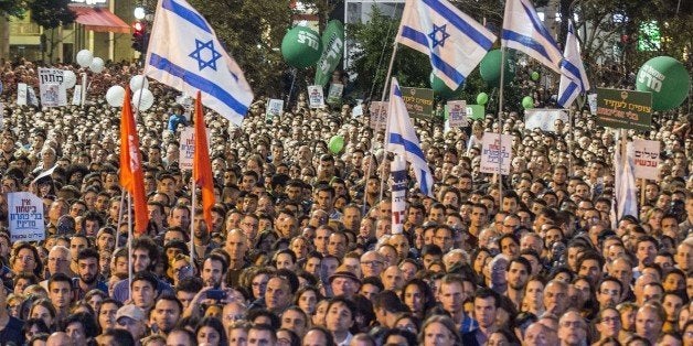 A general view shows people attending a commemorative rally in memory of late Israeli prime minister Yitzhak Rabin, at Rabin