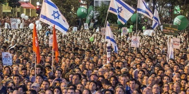 A general view shows people attending a commemorative rally in memory of late Israeli prime minister Yitzhak Rabin, at Rabin Square in the Israeli coastal city of Tel Aviv on October 31, 2015. The rally is part of commemorations marking the 20th anniversary of Rabin's killing by a right-wing Jewish extremist. AFP PHOTO / JACK GUEZ (Photo credit should read JACK GUEZ/AFP/Getty Images)