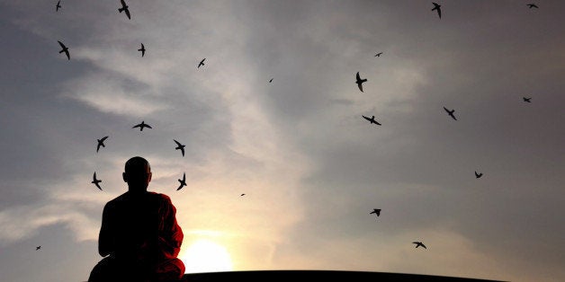 a buddhist monk in harmony as...