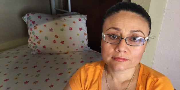 FILE -In this Thursday, July 30, 2015 file photo, Rosa Robles Loreto sits in her small room at Southside Presbyterian Church in Tucson, Ariz., where she has taken sanctuary from deportation. The 42-year-old mother of two will leave the church on Wednesday, Nov. 11, 2015. A spokeswoman says Robles Loreto's attorney came to a confidential agreement with the government that allows her to go home. (AP Photo/Astrid Galvan,File)