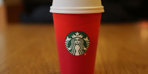 NEW YORK, NY - NOVEMBER 12: A new holiday Starbucks cup is viewed on November 12, 2015 in New York City. The coffee giant has come under criticism by some for leaving any Christmas or traditional holiday signage off of the red cup. While Starbucks has said there is no cultural or political message to the design, critics claim that the company doesn't want to offend non-Christians or those who don't celebrate Christmas. (Photo by Spencer Platt/Getty Images)