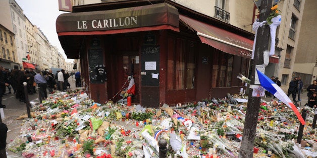 PARIS, FRANCE - NOVEMBER 16: A general view of the tributes outside the Le Carillon restaurant, one of the scenes of last fr