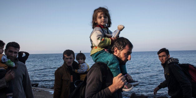SKALA SIKAMINIAS, GREECE - NOVEMBER 05: Refugees from Afghanistan and Syria arrive in boats on the shores of Lesbos on Novem