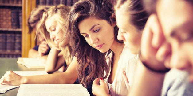 Students in the library studying together