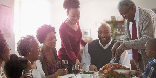 Family serving each other at holiday table