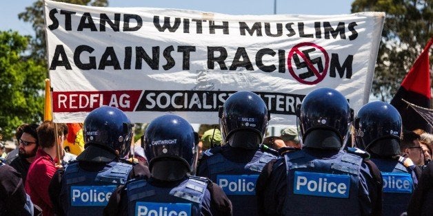 MELBOURNE, AUSTRALIA - NOVEMBER 22 : Riot police take security measures as anti-racist protesters stage a rival demonstration against a racist and Anti-Islamic protest organized by the far right wing group in Melbourne, Australia on November 22, 2015. (Photo by Asanka Brendon Ratnayake/Anadolu Agency/Getty Images)