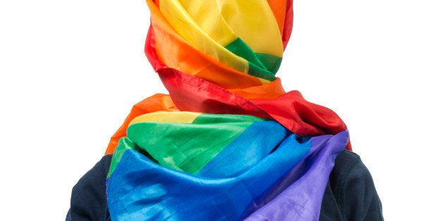 The human body wrapped in a gay flag which symbolises a muslim gay person.