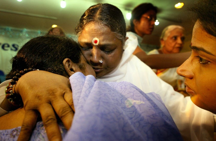 Amma The Hugging Saint S Answer To Natural Disasters And Suffering Huffpost Religion