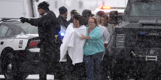 COLORADO SPRINGS, CO - NOVEMBER 27: People are rescued near the scene of a shooting at the Planned Parenthood clinic in Colorado Springs Friday November 27, 2015. (Photo by Andy Cross/The Denver Post via Getty Images)