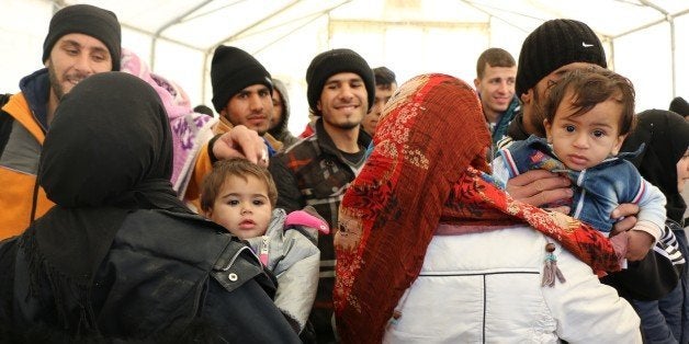 GEVGELIJA, MACEDONIA - NOVEMBER 30: Refugees wait in a tent because of governments' double standards over admittance policies for the refugees other than Syrians, Iraqis and Afghans, in Gevgelija, Macedonia on November 30, 2015. (Photo by Besar Ademi/Anadolu Agency/Getty Images)