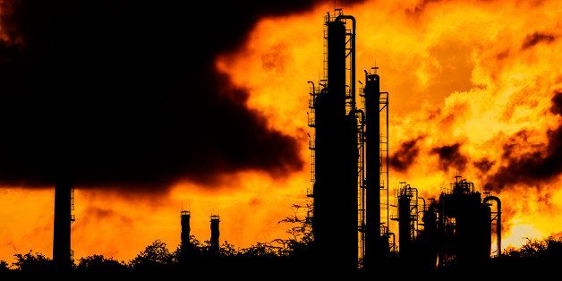 silhouette of refinery plant on evening background