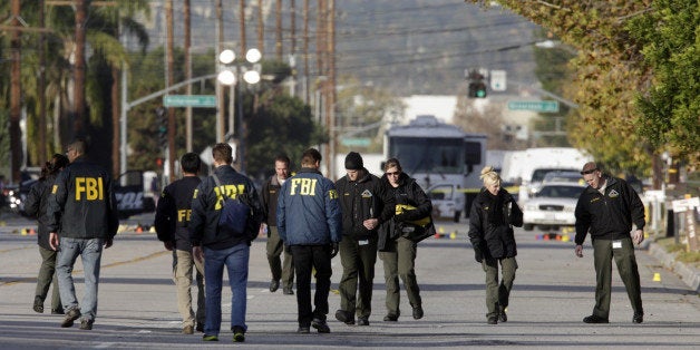 SAN BERNARDINO, CA - DECEMBER 3: Law enforcement personnel continue to investigate on San Bernardino Avenue, where two suspe
