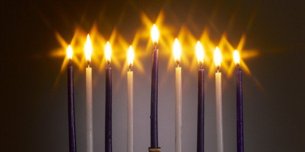 Menorah with lit candles, studio shot