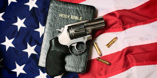 A handgun resting on a Bible and an American flag, representing the Second Amendment of the US Constitution, the right of pat