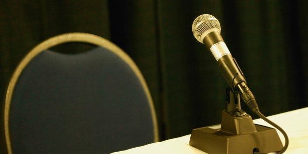 Empty chair and table with microphone