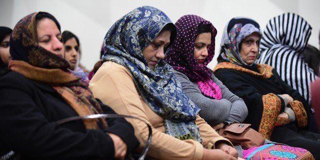 Muslim women attend a vigil at the Ahmadiyya Muslim Community in Chino, California on December 3, 2015, to commemorate lives lost a day after the tragedy in San Bernardino. AFP PHOTO/ FREDERIC J. BROWN / AFP / FREDERIC J. BROWN (Photo credit should read FREDERIC J. BROWN/AFP/Getty Images)