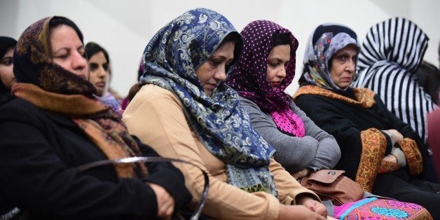 Muslim women attend a vigil at the Ahmadiyya Muslim Community in Chino, California on December 3, 2015, to commemorate lives